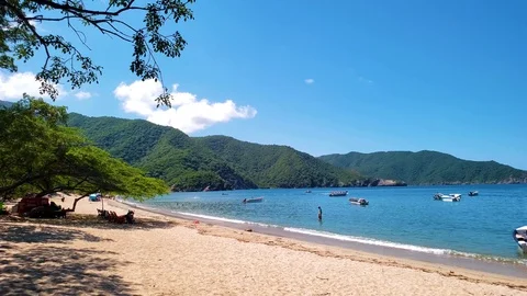 Wide angle slow motion walk-through the beach of BAHIA CONCHA at Parque Tayrona Stock Footage 103952719