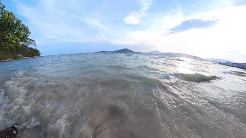 Wide angle, slowmotion of wave on beach 100fps sea water, ocean, blue sky, .. Stock-Footage 269492578