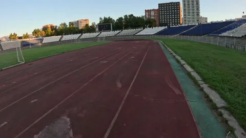 Wide Angle Stadium Running Sequence Featuring Football Field Goal Scoreboard and Stock Footage 321526392
