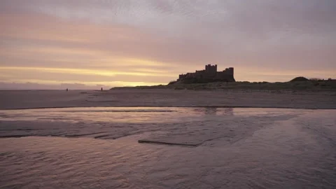 A wide-angle static shot of the dramatic Bamburgh Castle 動画素材 326420880