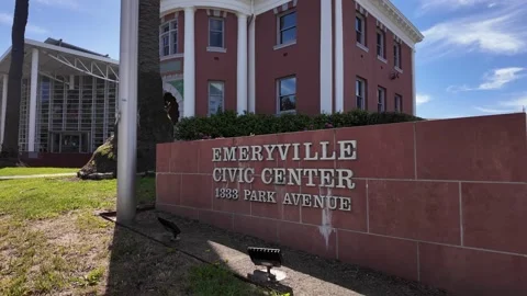 Wide angle static shot of Emeryville Civic Center, red-brick municipal building Stock Footage 341471560