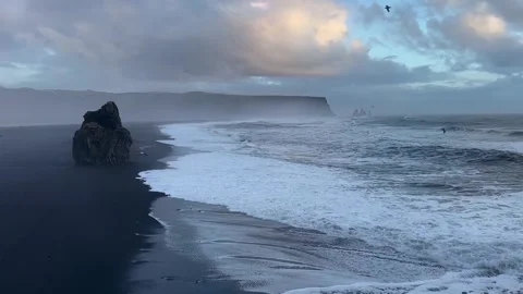 Wide angle static shot of Reynisfjara black sand beach and Reynisdrangar ba.. Stock Footage 327683727