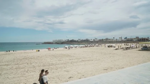Wide angle static shot of a sunny day at the beach Stock Footage 100396798