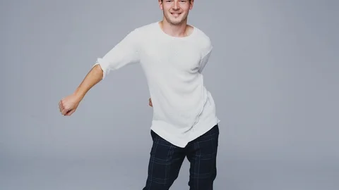 Wide Angle Studio Shot Of Young Man Against White Background Dancing And Stock Footage 119848786