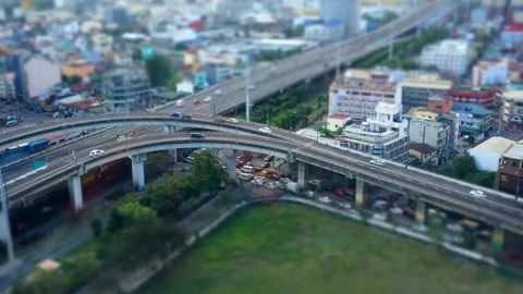 Wide-angle tilt-shift lens timelapse of traffic intersection seen from above Stock Footage 229772544