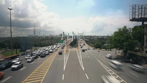 Wide angle time lapse of multi lane roadway with many cars driving fast Stock Footage 245372920