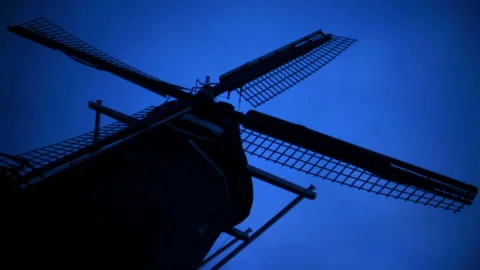 Wide angle time lapse of a traditional Dutch windmill standing still Stock Footage 142234933