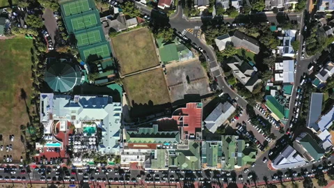 Wide angle top down flying over Camps Bay beach and out over the ocean Stock Footage 170725590