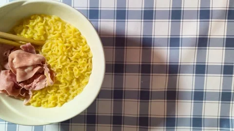 Wide angle top down view of delicious tasty asian ramen noodles cuisine in a whi 動画素材 318258091