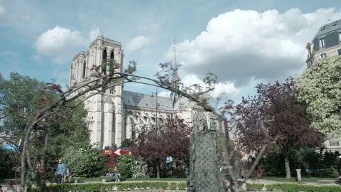 Wide Angle Track Left Notre Dame Cathedral Park View From Across Street Paris Stock Footage 93599218