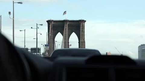 Wide angle tracking shot of traffic on Brooklyn Bridge shot from a moving car. Stock Footage 135797832