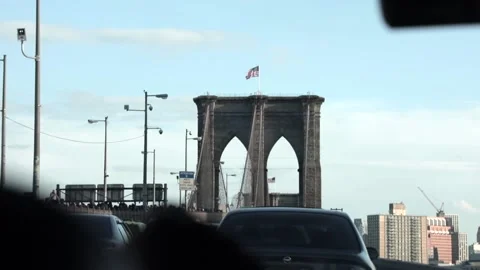 Wide angle tracking shot of traffic on Brooklyn Bridge shot from a moving car. Stock Footage 135797836