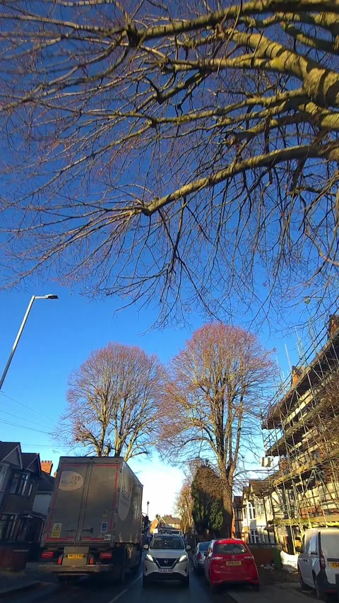 Wide Angle Vertical Footage of British Urban City Streets During Car Drive Vídeos de archivo 327448799