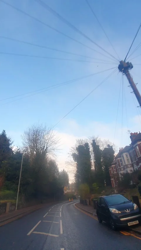 Wide Angle Vertical Footage of British Urban City Streets During Car Drive Stock Footage 327449045