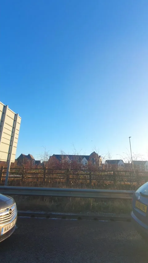 Wide Angle Vertical Footage of British Urban City Streets During Car Drive Stock Footage 327449244