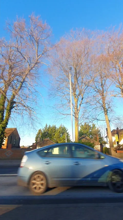 Wide Angle Vertical Footage of British Urban City Streets During Car Drive Stock Footage 327449956