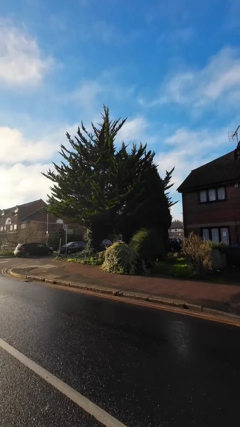 Wide Angle Vertical Footage of British Urban City Streets During Car Drive Vídeo Stock 327450756
