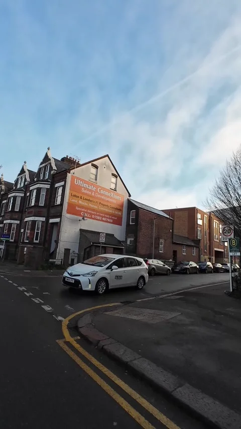 Wide Angle Vertical Footage of British Urban City Streets During Car Drive Stock Footage 327450955