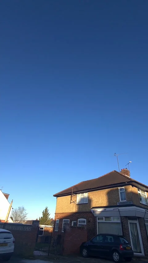 Wide Angle Vertical Footage of British Urban City Streets During Car Drive Stock Footage 327451075