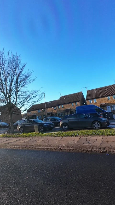 Wide Angle Vertical Footage of British Urban City Streets During Car Drive Stock Footage 327451179