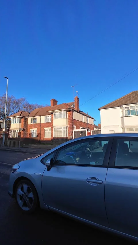 Wide Angle Vertical Footage of British Urban City Streets During Car Drive Stock Footage 327451661