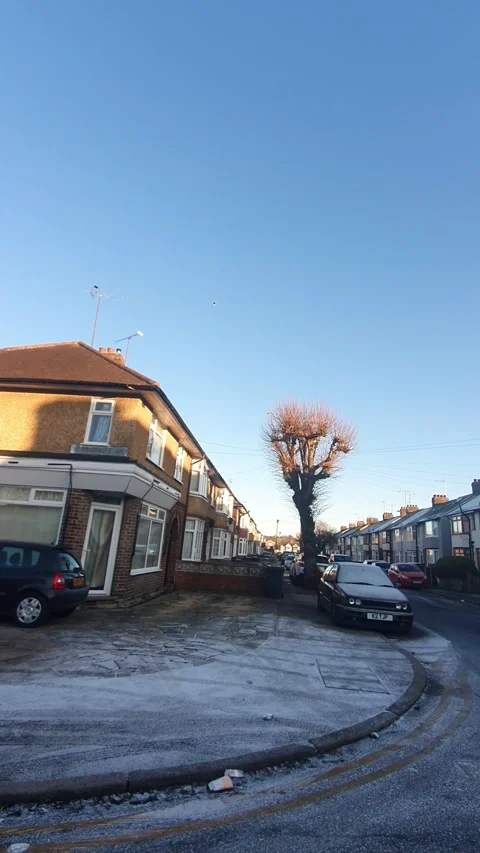 Wide Angle Vertical Footage of British Urban City Streets During Car Drive Stock Footage 327452026