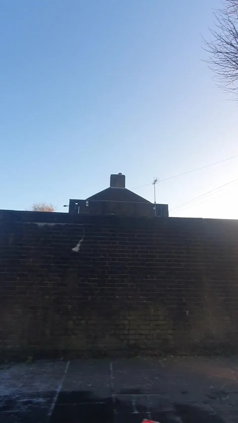Wide Angle Vertical Footage of British Urban City Streets During Car Drive Stock Footage 327452036