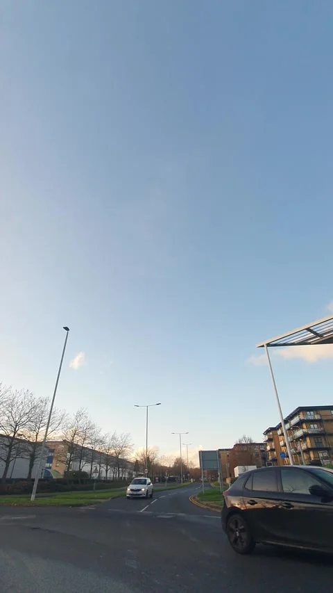 Wide Angle Vertical Footage of British Urban City Streets During Car Drive Stock Footage 327452376