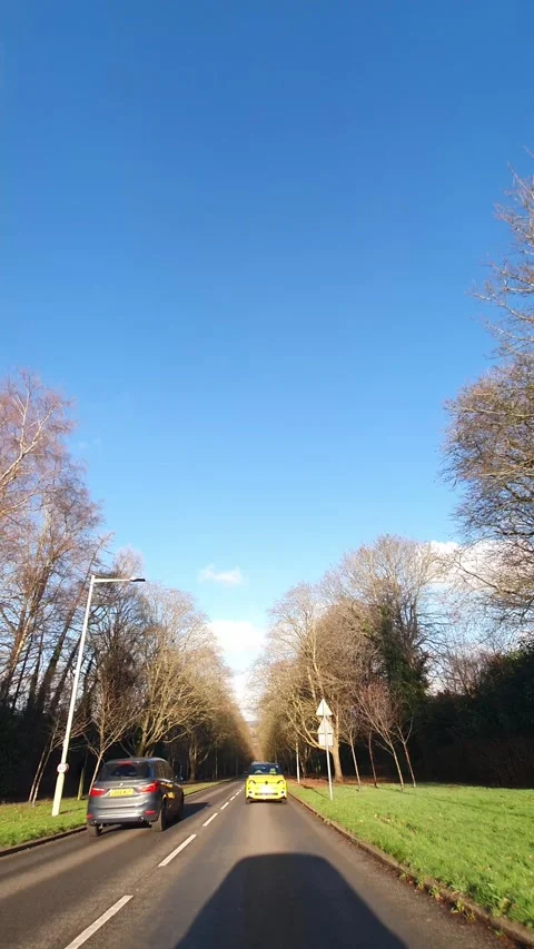 Wide Angle Vertical Footage of British Urban City Streets During Car Drive Stock Footage 327452636