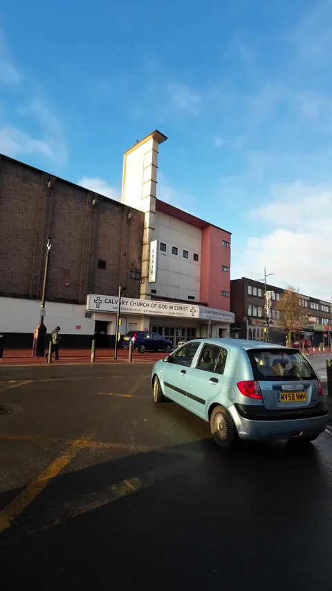 Wide Angle Vertical Footage of British Urban City Streets During Car Drive Stock Footage 327453264