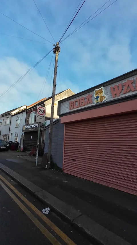 Wide Angle Vertical Footage of British Urban City Streets During Car Drive Stock Footage 327453373