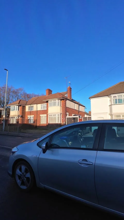 Wide Angle Vertical Footage of British Urban City Streets During Car Drive Stock Footage 327453654