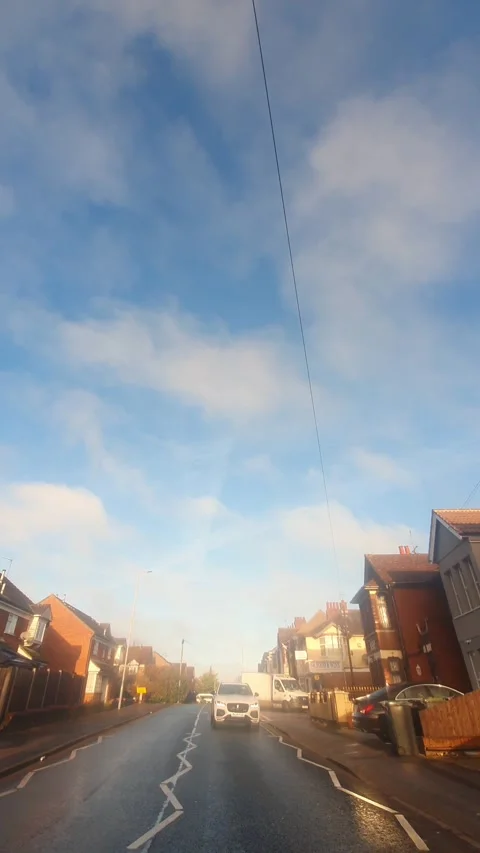 Wide Angle Vertical Footage of British Urban City Streets During Car Drive Stock Footage 327453740