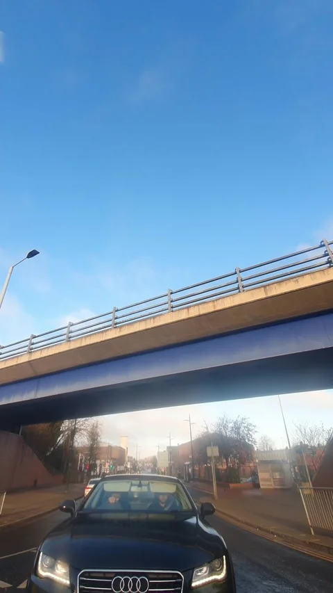 Wide Angle Vertical Footage of British Urban City Streets During Car Drive Stock Footage 327453840