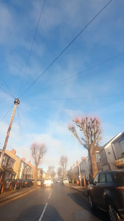 Wide Angle Vertical Footage of British Urban City Streets During Car Drive Vídeo Stock 327453993