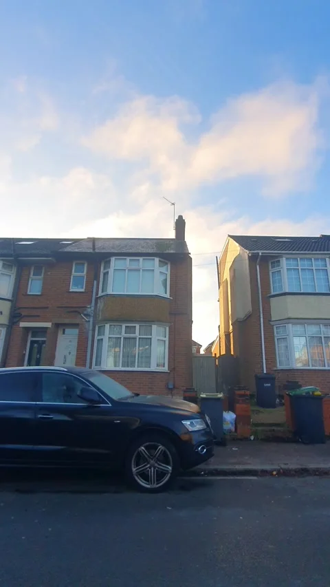Wide Angle Vertical Footage of British Urban City Streets During Car Drive Stock Footage 327454470