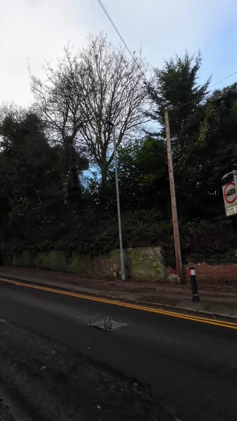 Wide Angle Vertical Footage of British Urban City Streets During Car Drive Vídeo Stock 327454720
