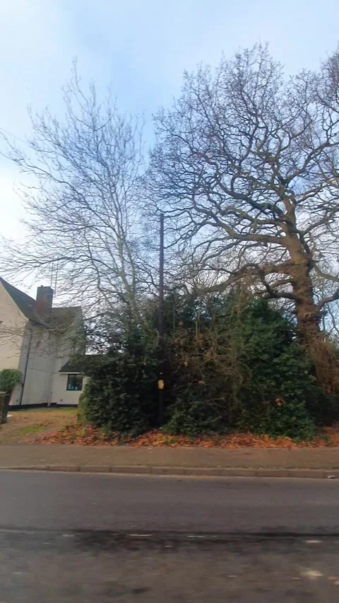 Wide Angle Vertical Footage of British Urban City Streets During Car Drive Stock Footage 327455454