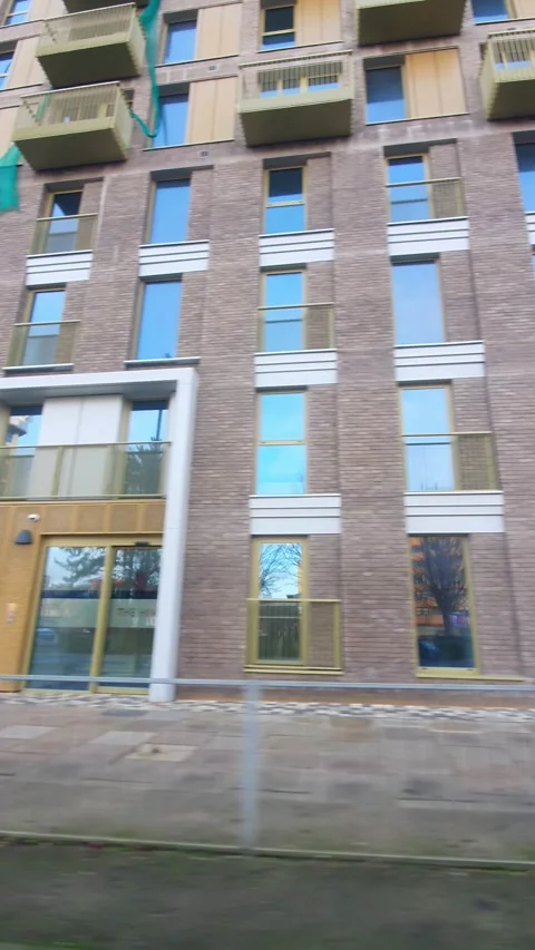 Wide Angle Vertical Footage of British Urban City Streets During Car Drive Stock Footage 327455581