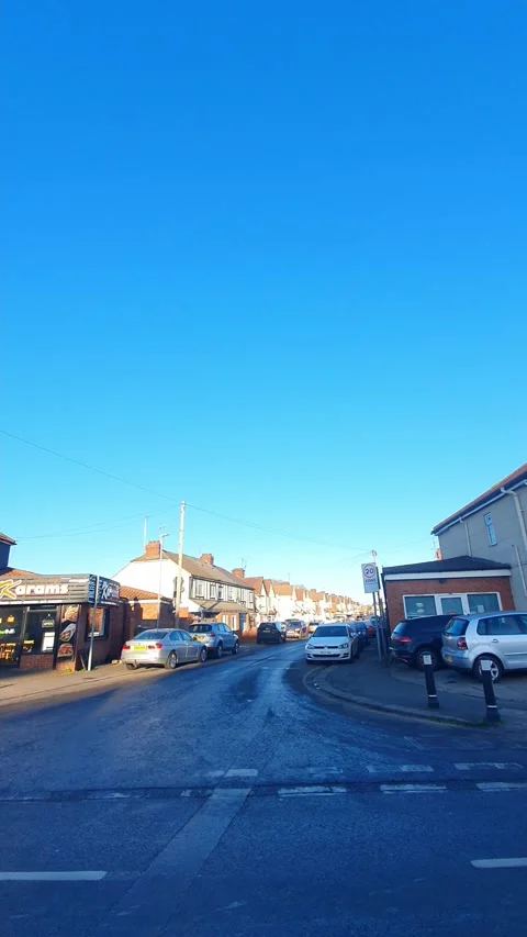 Wide Angle Vertical Footage of British Urban City Streets During Car Drive Stock Footage 327458367