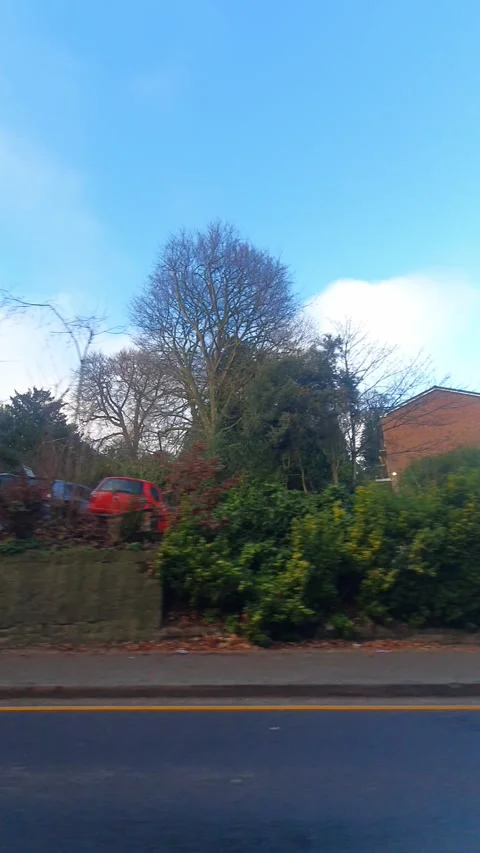 Wide Angle Vertical Footage of British Urban City Streets During Car Drive Vídeos de archivo 327459489