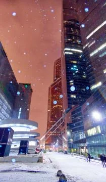 Wide angle vibrant view of heavy snowfall in downtown skyscraper area of wint Stock Photos