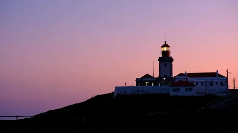 Wide angle video of Cabo da Roca Lighthouse over the cliffs at dusk, Portugal Video stock 108096863