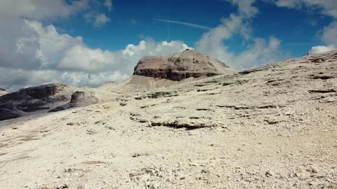 Wide-angle view of alpine mountain plateau under partly cloudy sky Stock Footage 342342155