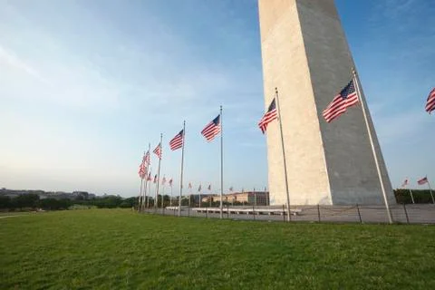 Wide angle view base of washington monument with flags Stock Photos