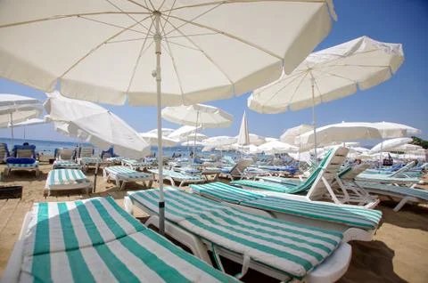 Wide angle view of beach umbrella sunny day Stock Photos