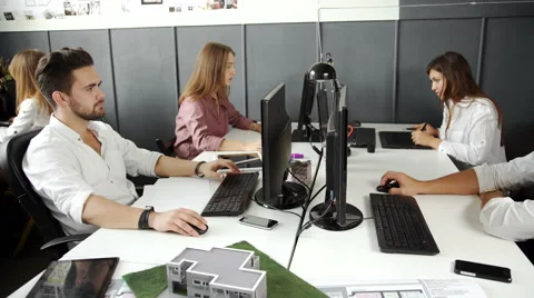 Wide Angle View Of Busy Design Office With Workers At Desks. 20s 4k Vídeos de archivo 68207669