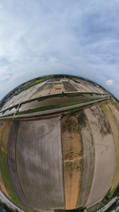 Wide-angle view captures expansive agricultural fields below Stock Footage 345409637