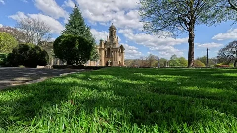 Wide angle view of Cartwright Hall and lawn in Lister Park, Bradford Stock Footage 333793970