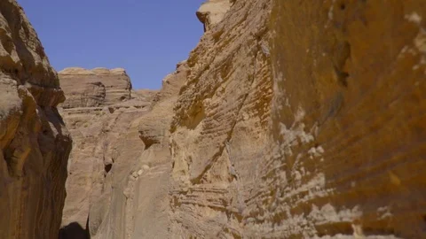 Wide angle view close to the mountain wall in a canyon in the desert in Petra Stock Footage 103521472